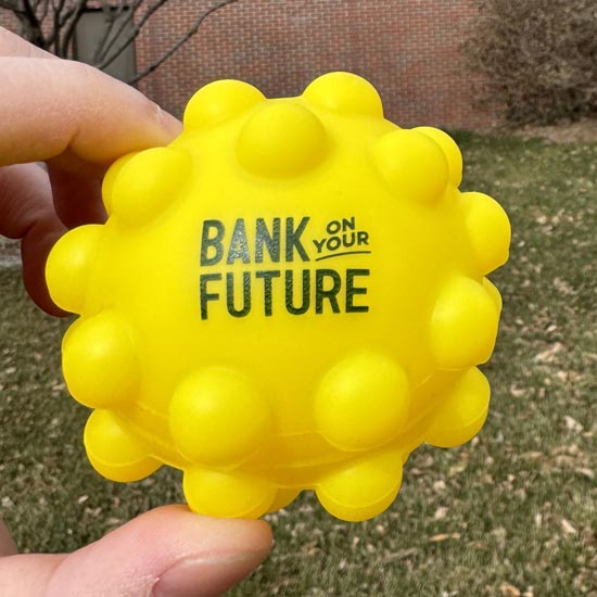 Yellow ball with the words "bank in your future" on it